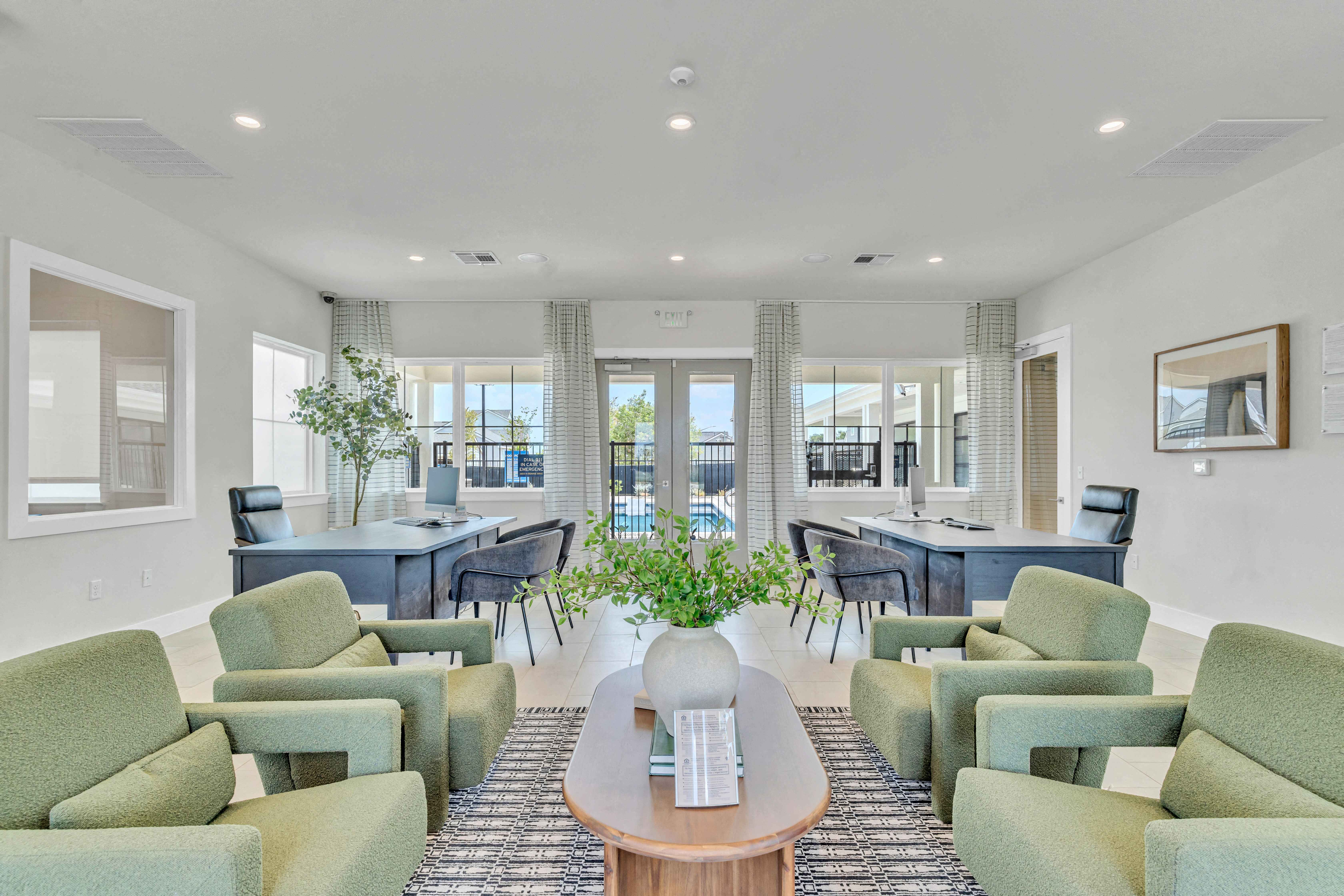 a living room with couches and chairs and a table